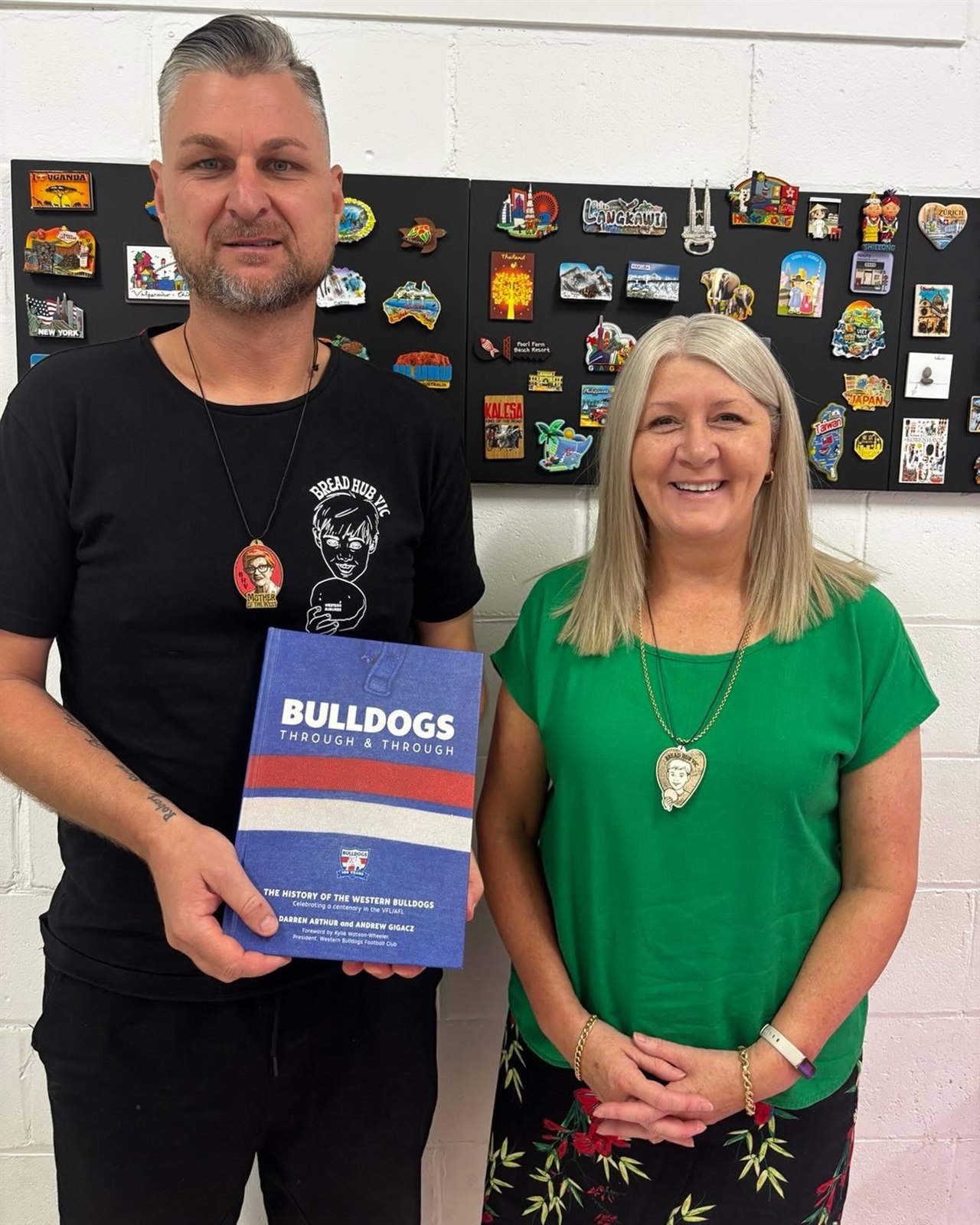Bread Hub Victoria supporter holding a community book
