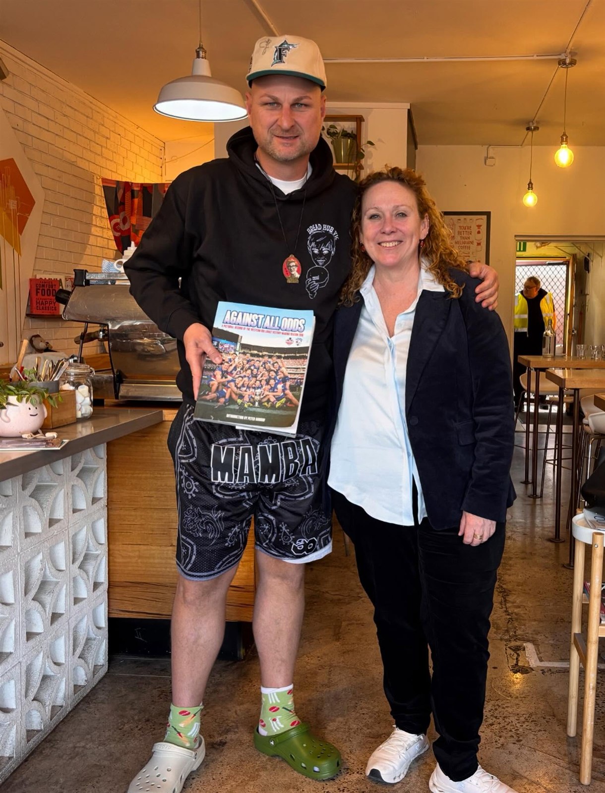 Bread Hub Victoria community member with a supporter in a local café