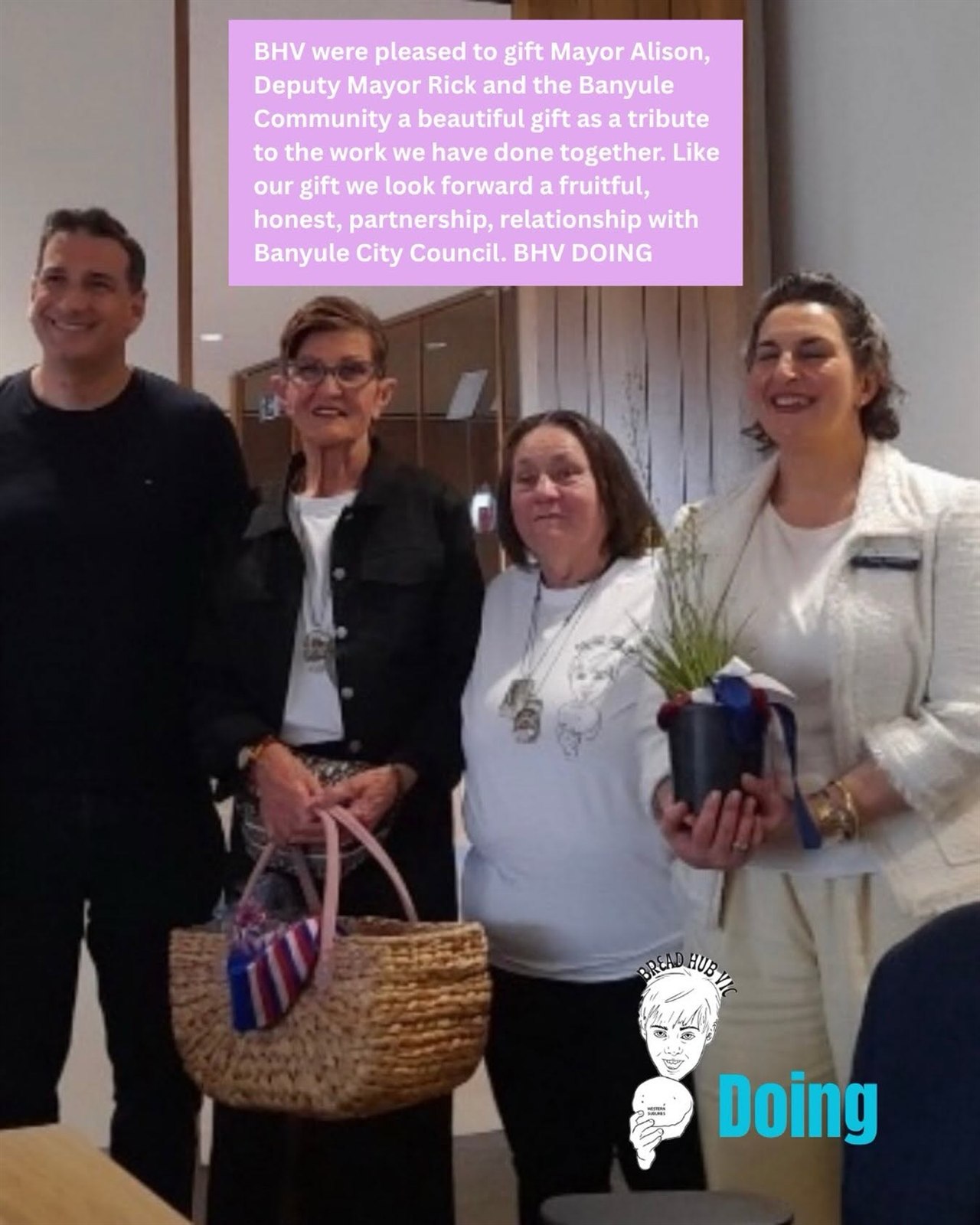 Bread Hub Victoria community members presenting a gift at a Banyule gathering